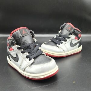 Kids Jordan Black and Red Sneakers
